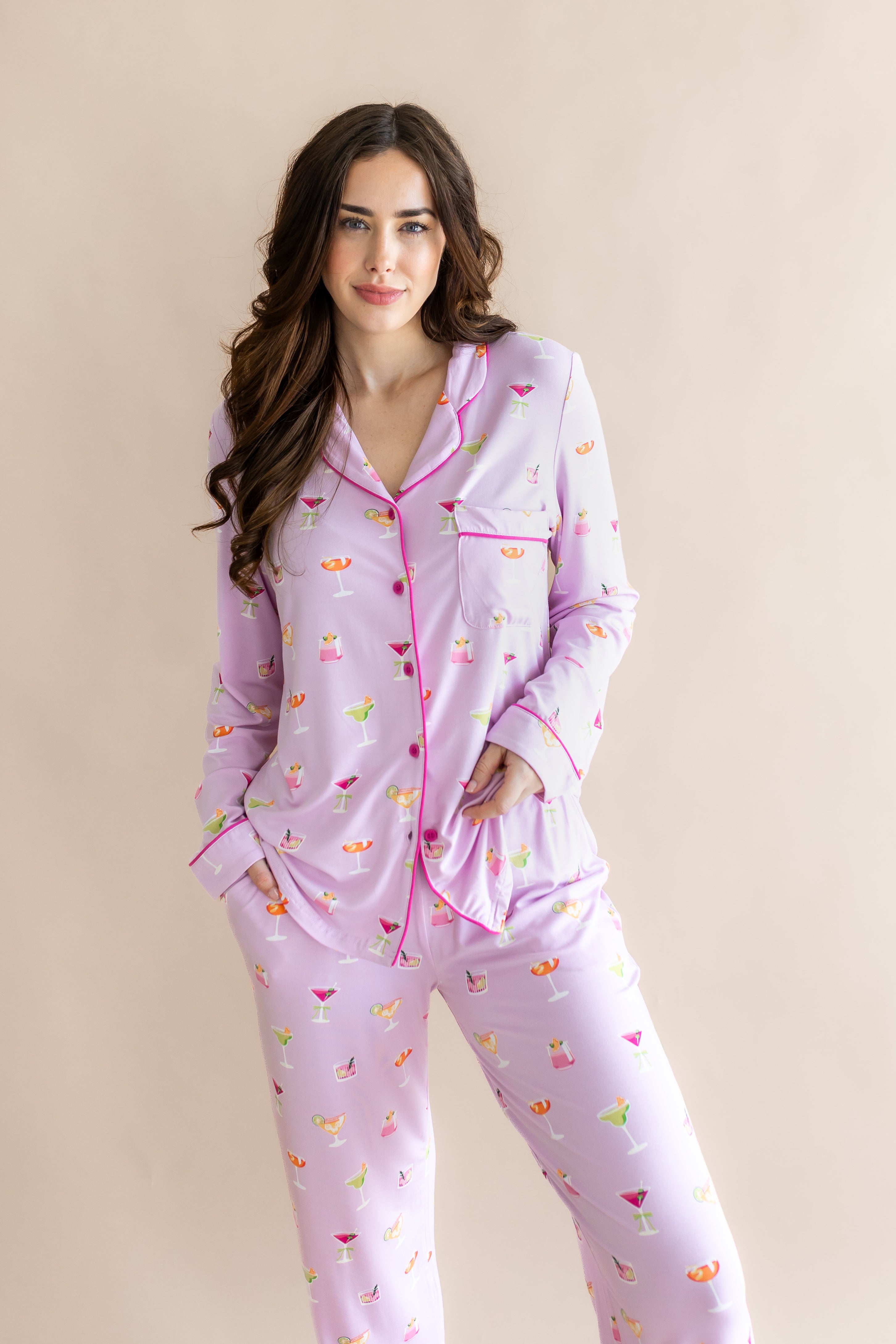 Woman with brown hair modeling the Long-Sleeved Women's Pajama Set in Cocktail with her hand in the bottoms pocket
