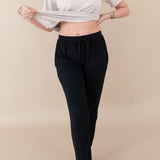 Woman modeling Women's Jogger Pants in Midnight showing off waist band