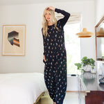 Model wearing Adult sleeveless Sleep Bag Walker in Midnight Wildflower in a room

::: Model is 5'11" wearing size S/M ///