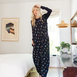 Model wearing Adult sleeveless Sleep Bag Walker in Midnight Wildflower in a room

::: Model is 5'11" wearing size S/M ///