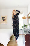 Model wearing Adult sleeveless Sleep Bag Walker in Midnight Wildflower in a room

::: Model is 5'11" wearing size S/M ///