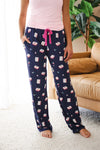 Close up of the model wearing Women's lounge pants in Navy Mahjong print standing in front of sofa

::: Model is 5'5" wearing size M ///