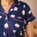 Close up of Women' short sleeve shirt with pocket in Navy Mahjong print with a pink trim