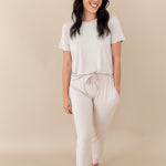 Woman modeling Women's Jogger Pants in Oat with hands in pockets