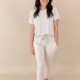 Woman modeling Women's Jogger Pants in Oat with hands in pockets