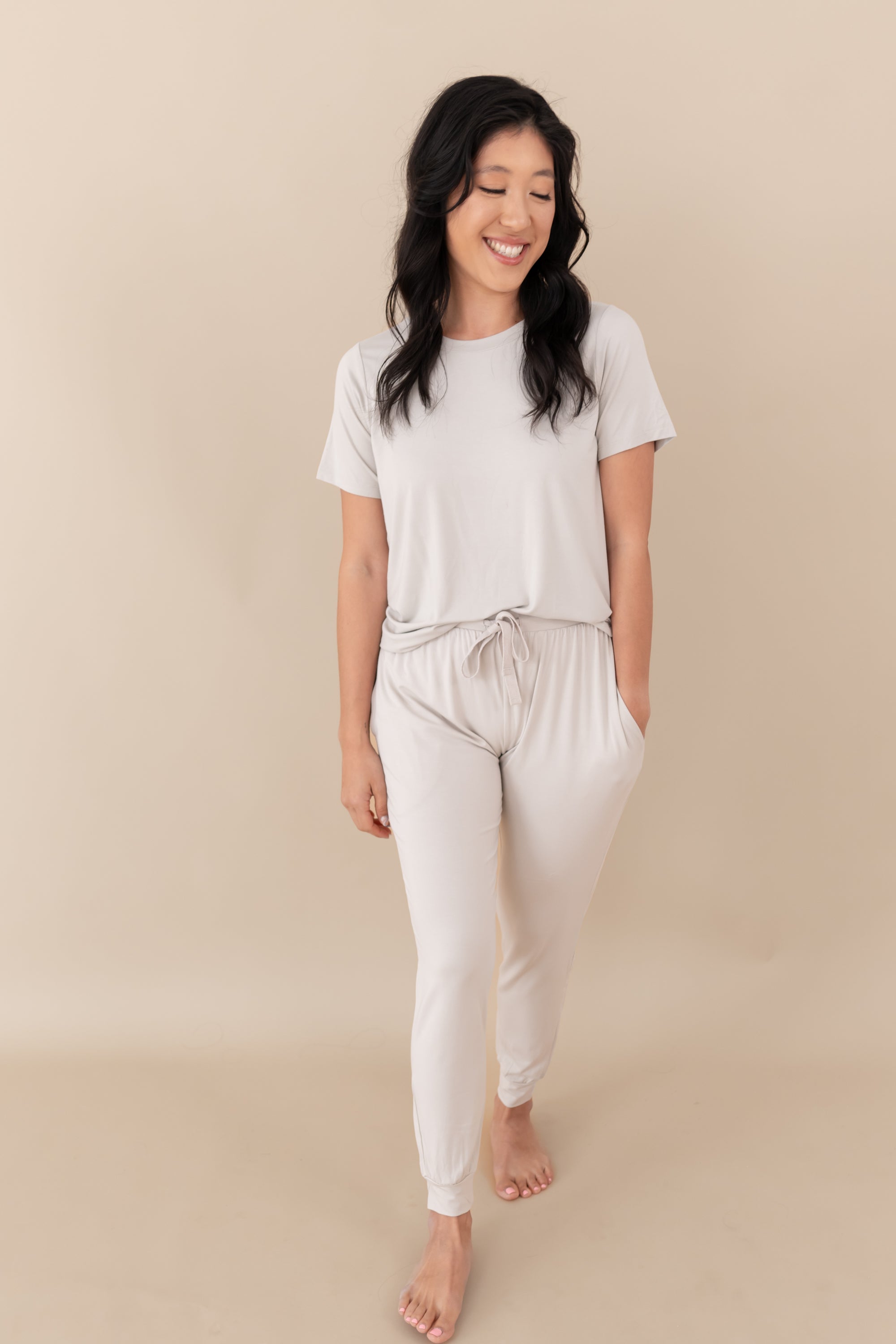 Woman modeling Women's Jogger Pants in Oat with hands in pockets