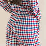 Back side of Long-Sleeved Women's Pajama Set in Patriotic Gingham print on a beige background