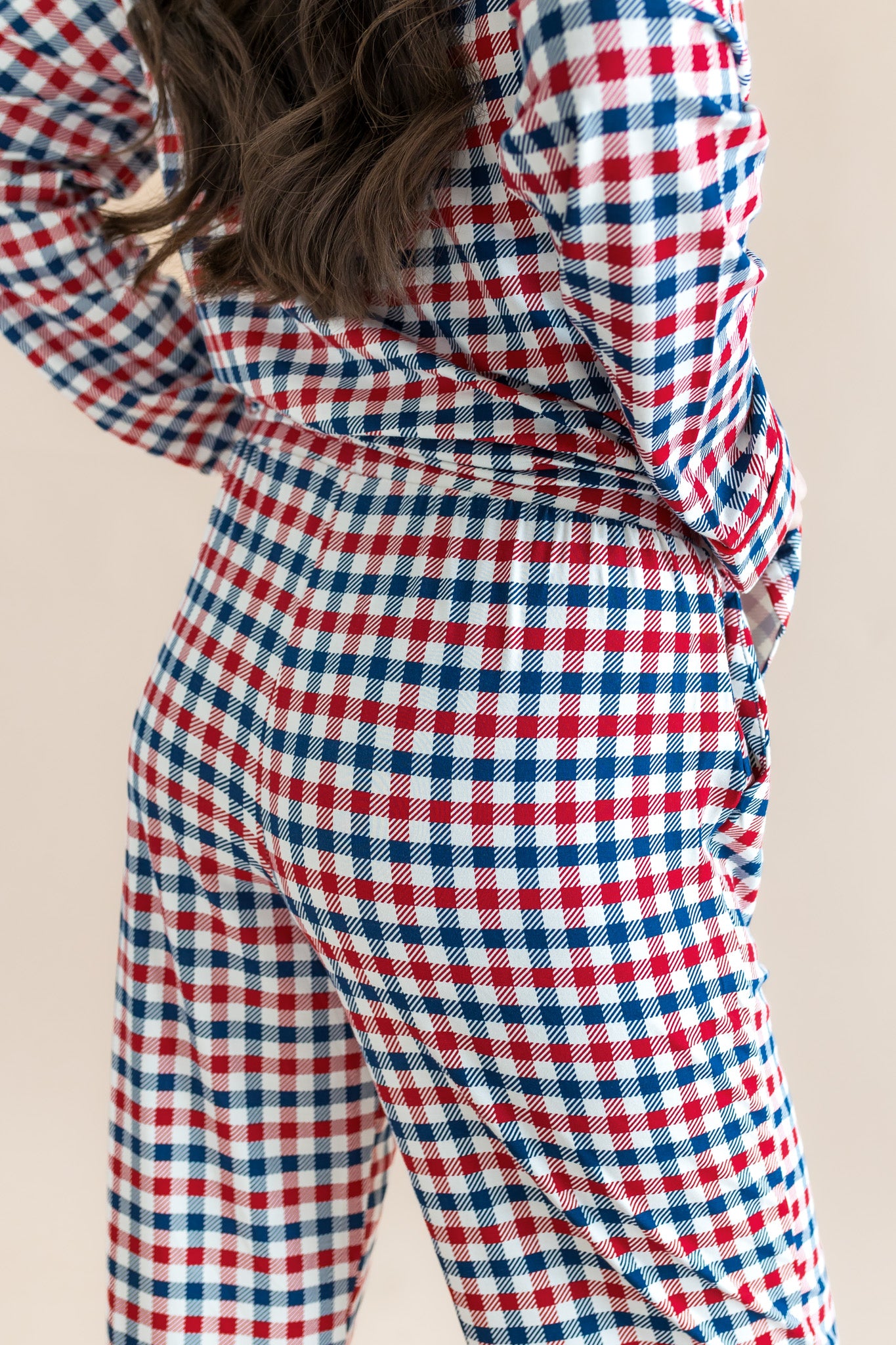 Back side of Long-Sleeved Women's Pajama Set in Patriotic Gingham print on a beige background