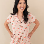 Woman modeling Women’s Short Sleeve Pajama Set in Peach with hands on hips