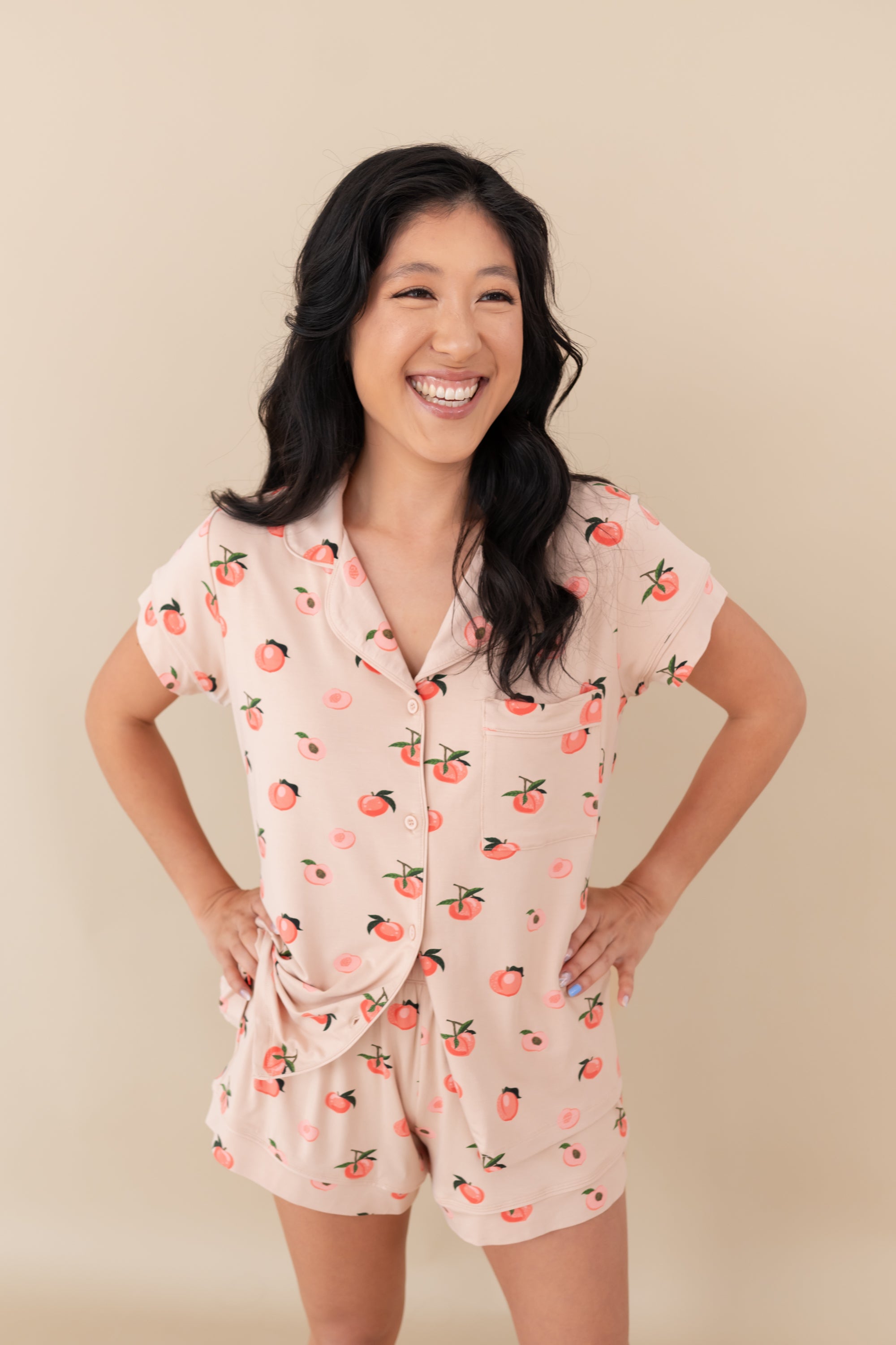 Woman modeling Women’s Short Sleeve Pajama Set in Peach with hands on hips