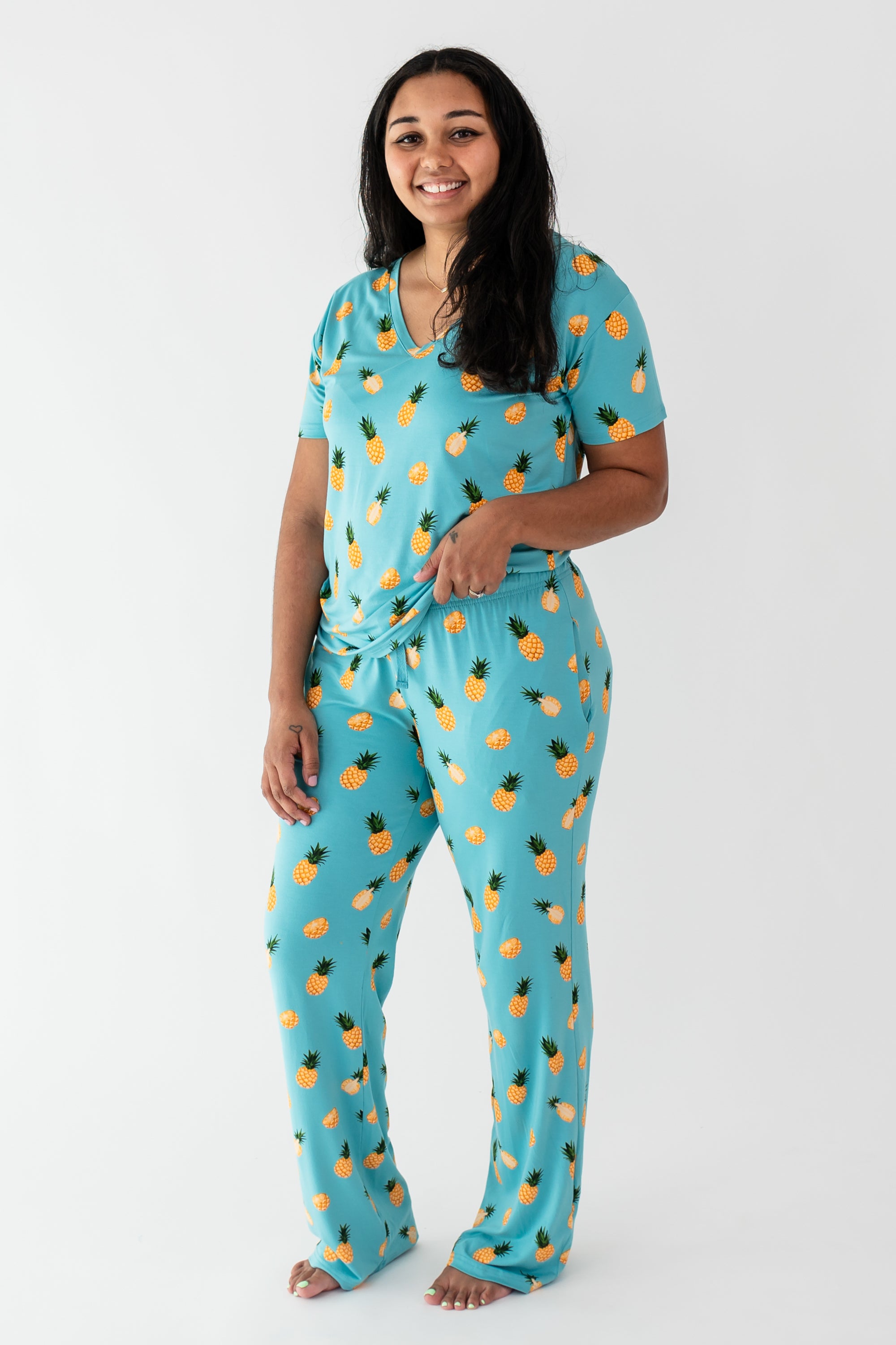 Woman modeling Women’s Relaxed Fit V-Neck in Pineapple and Lounge Pants in Pineapple