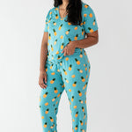 Woman modeling Women's Lounge Pants in Pineapple with a matching v-neck