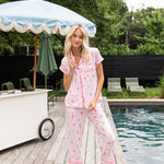 Model posing near pool side wearing Women's Short Sleeve Cropped Pajama Set in Sakura Ice Cream

::: Model is 5'11" wearing size S ///