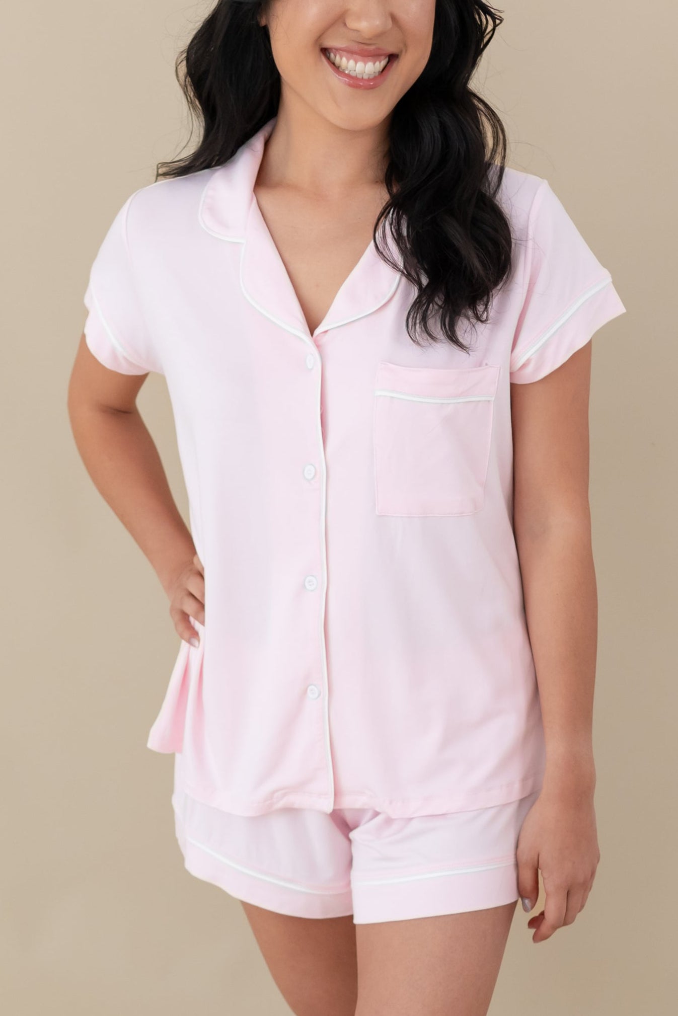 Woman modeling soft bamboo Short Sleeve Pajamas with shorts in pink and white
