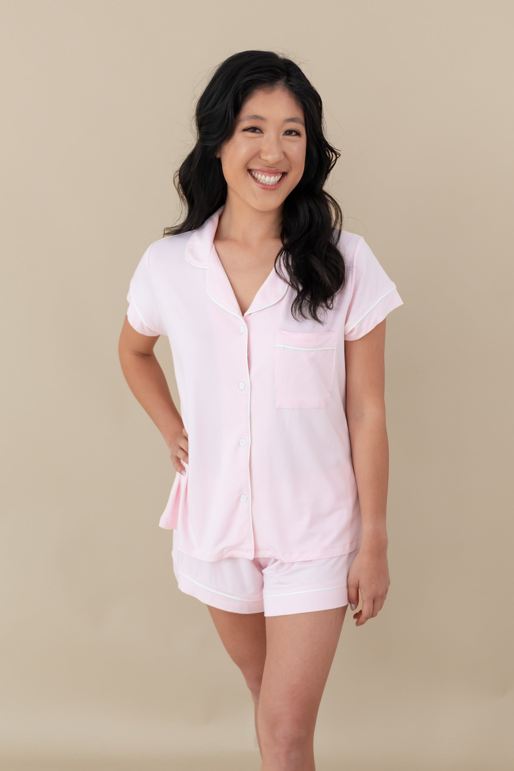 Woman modeling Women’s Short Sleeve Pajama Set in Sakura with Cloud Trim with hand on hip