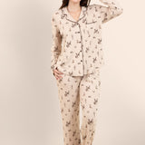 Female modeling the Long-Sleeved Women's Pajama Set in Classic Cowboy in front of a light neutral background ::: Model is 5'7" wearing size M ///