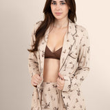 Female modeling the Long-Sleeved Women's Pajama Set in Classic Cowboy with the shirt unbuttoned showing the espresso cross front bralette on underneath