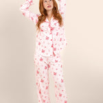 Female modeling the Long-Sleeved Women's Pajama Set in Disco Cowgirl standing in front of a light beige background ::: Model is 5'3" wearing size XS ///