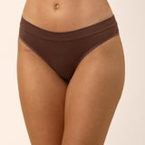 Brown underwear worn by a person on a beige background