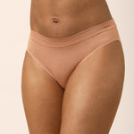 Bra and panties set in a tan color on a beige background