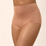 Tan high-waisted underwear on a beige background