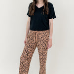 Smiling woman modeling Women's Lounge Pants in Leopard Latte