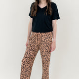Smiling woman modeling Women's Lounge Pants in Leopard Latte