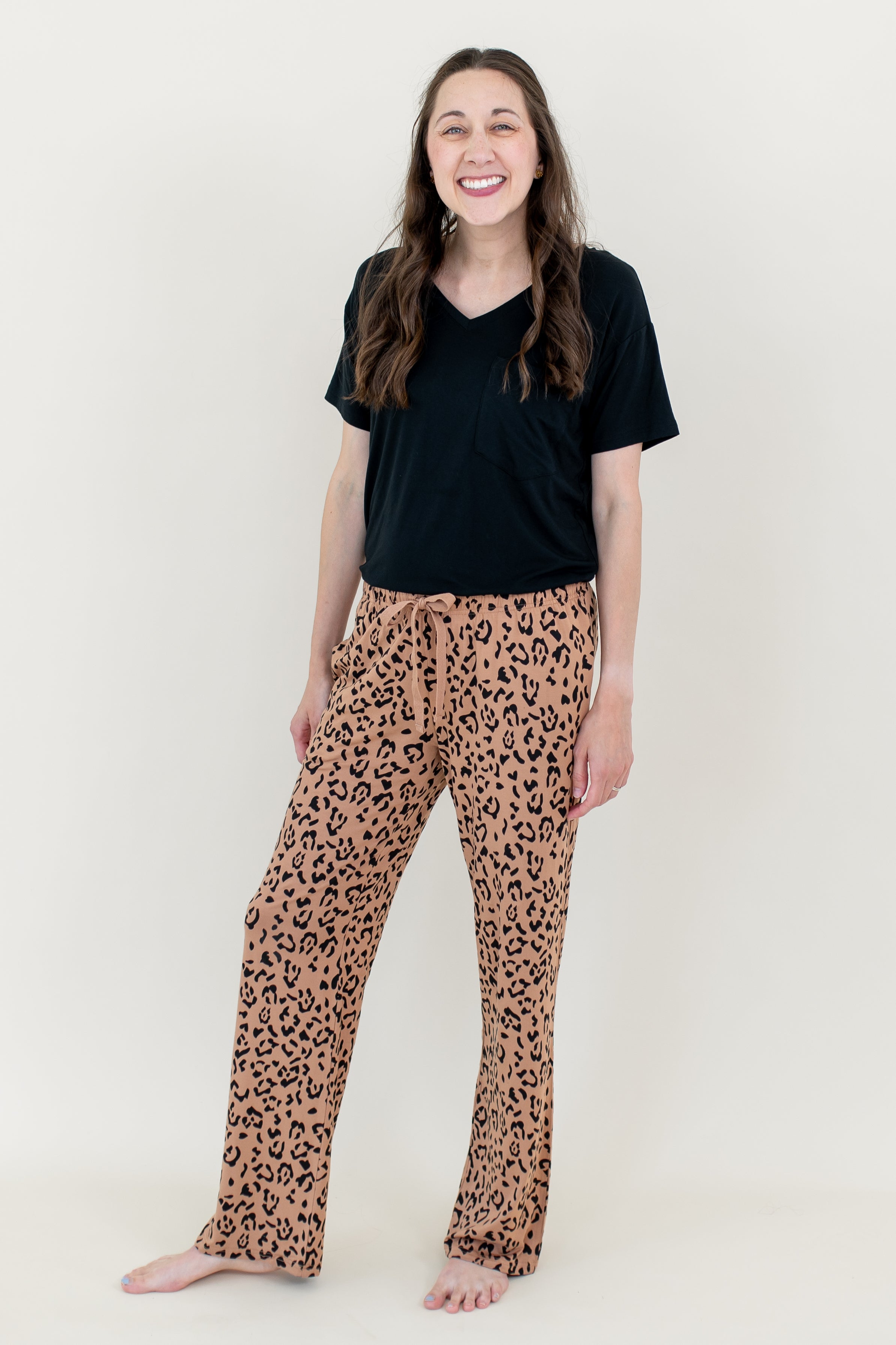 Smiling woman modeling Women's Lounge Pants in Leopard Latte