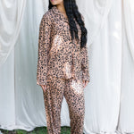 Model looking to the side while wearing the Long Sleeve Pajama Set in Latte Leopard