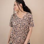Model looking to the side and close up of the Women's V Neck Tee in Latte Leopard