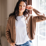 Woman with her arm propped on the window wearing a cropped cardigan in late and jeans
::: Model is 5'9" wearing size S ///