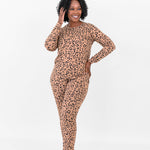 Model with one hand on hip and one hand on head wearing the Kyte Jogger Set in Leopard Latte