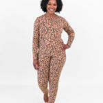 Smiling woman walking towards camera while modeling the Jogger Set in Leopard Latte