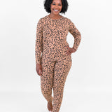 Smiling woman walking towards camera while modeling the Jogger Set in Leopard Latte