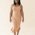 Smiling model in the Women's Ribbed Cami Dress in Latte