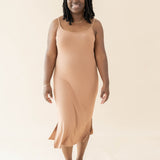Smiling model in the Women's Ribbed Cami Dress in Latte