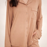 Close up of the button closures and chest pocket of the Long-Sleeved Women's Pajama Set in Latte with Latte Trim shown on a model