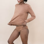 Smiling woman modeling the Women's Underwear in Latte with matching top