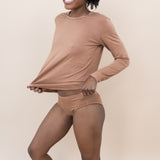 Smiling woman modeling the Women's Underwear in Latte with matching top