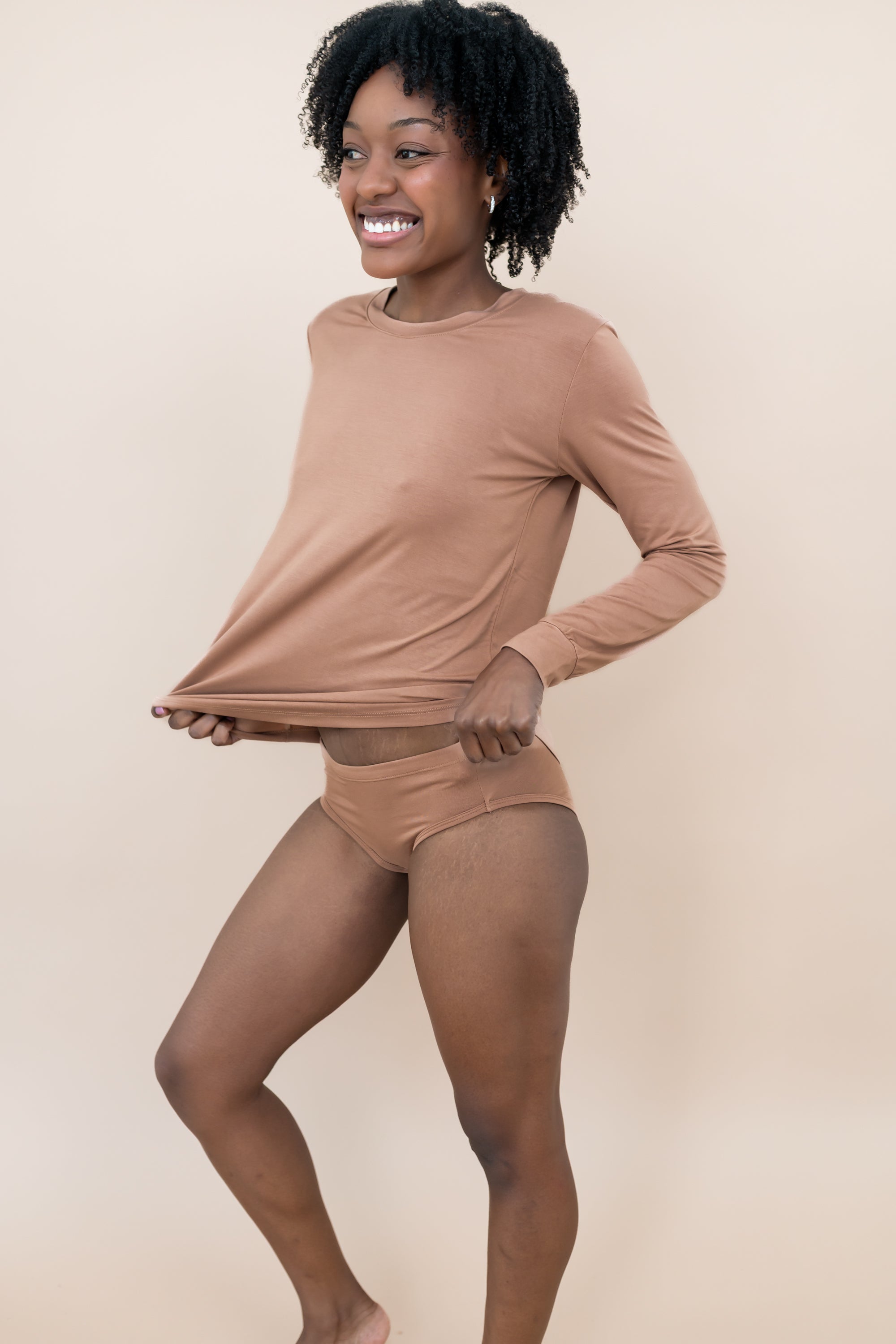 Smiling woman modeling the Women's Underwear in Latte with matching top