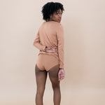 Woman modeling the back of the Women's Underwear in Latte with matching top