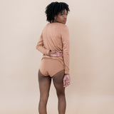 Woman modeling the back of the Women's Underwear in Latte with matching top