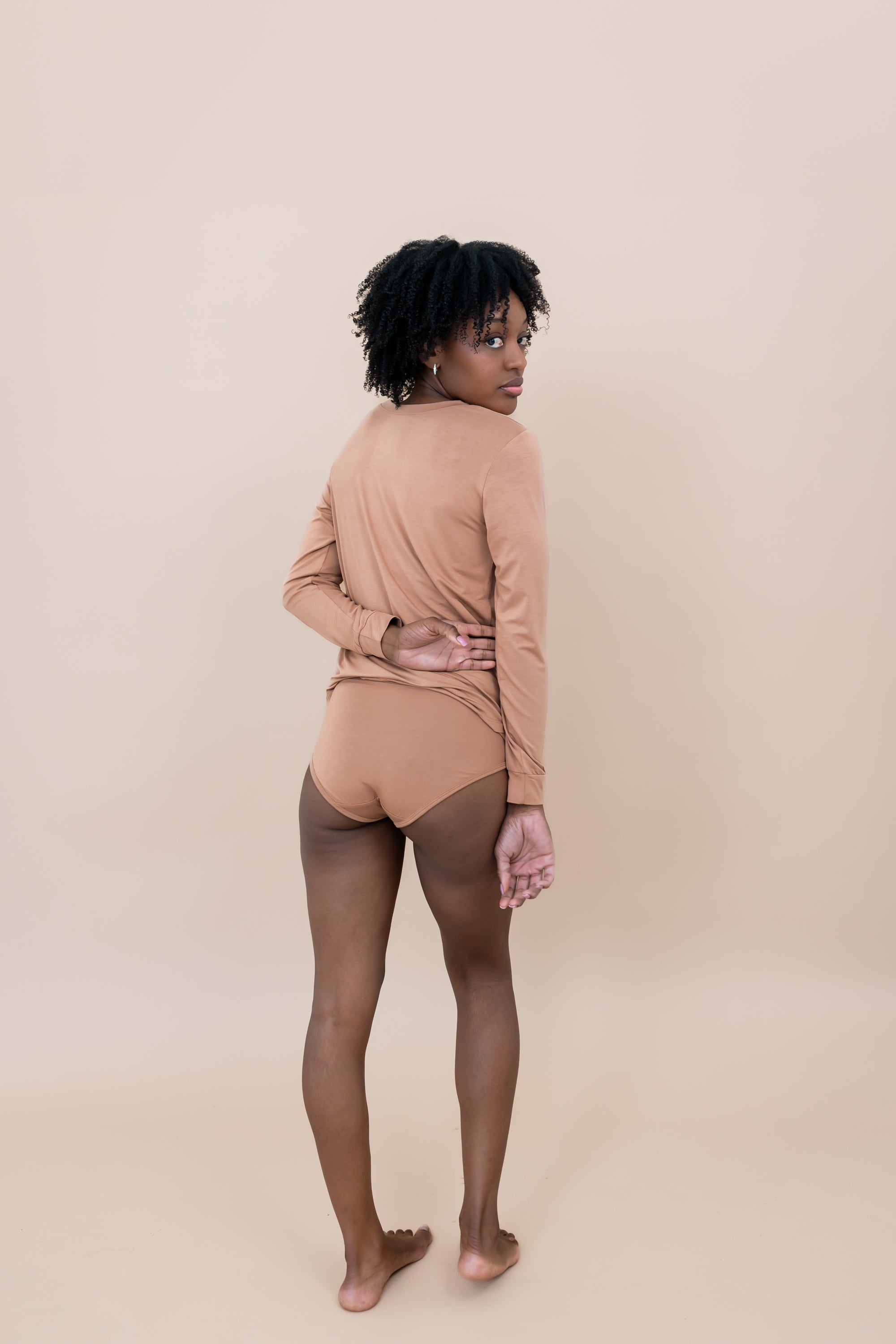 Woman modeling the back of the Women's Underwear in Latte with matching top