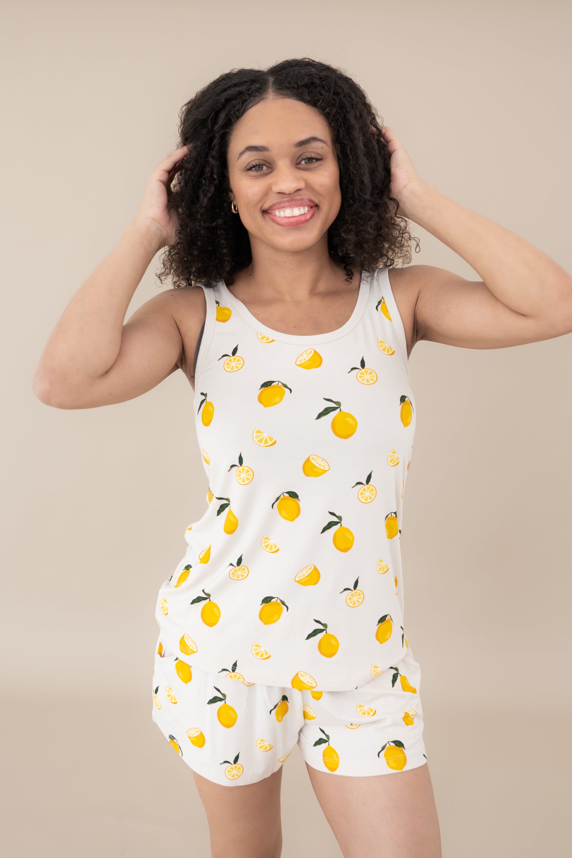 Female modeling the Women’s Tank Set in Lemon
