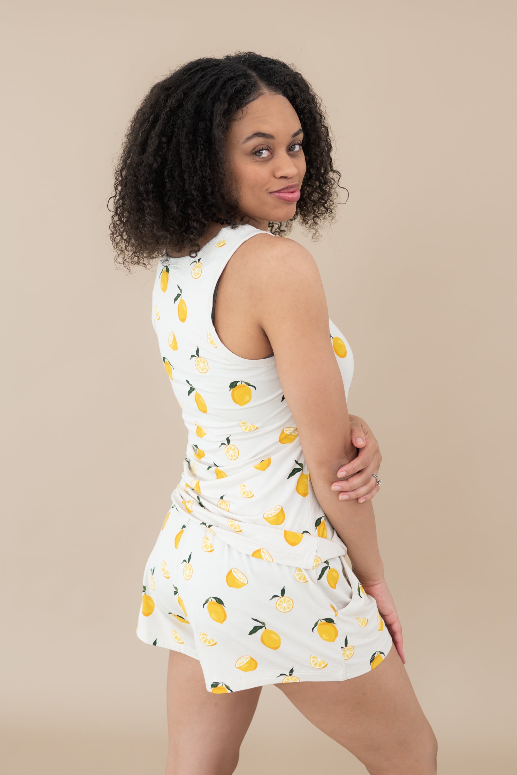 Female modeling the back of the Women’s Tank Set in Lemon