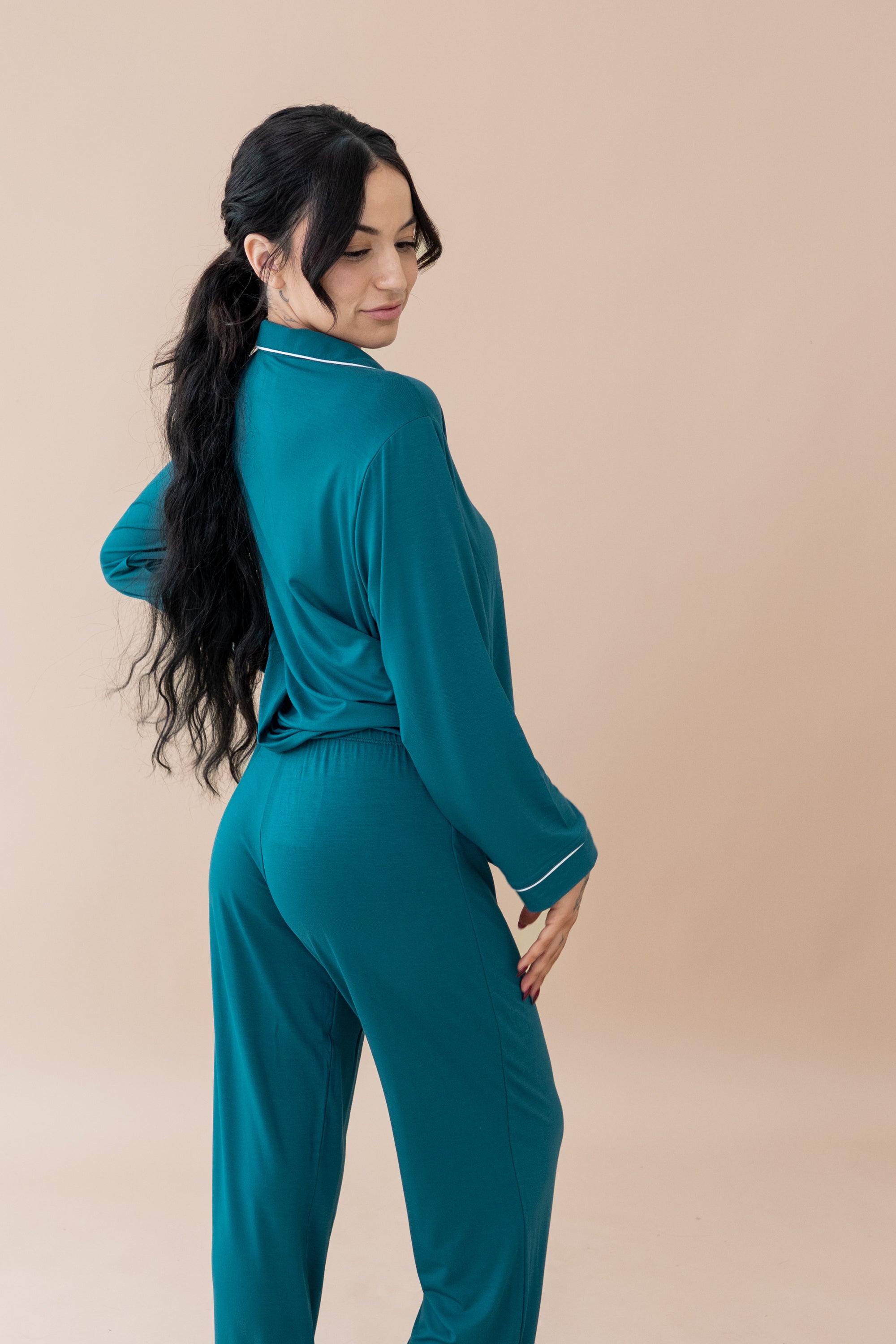 Female modeling the back of Women's Long Sleeve Pajama Set in Loch with Cloud Trim