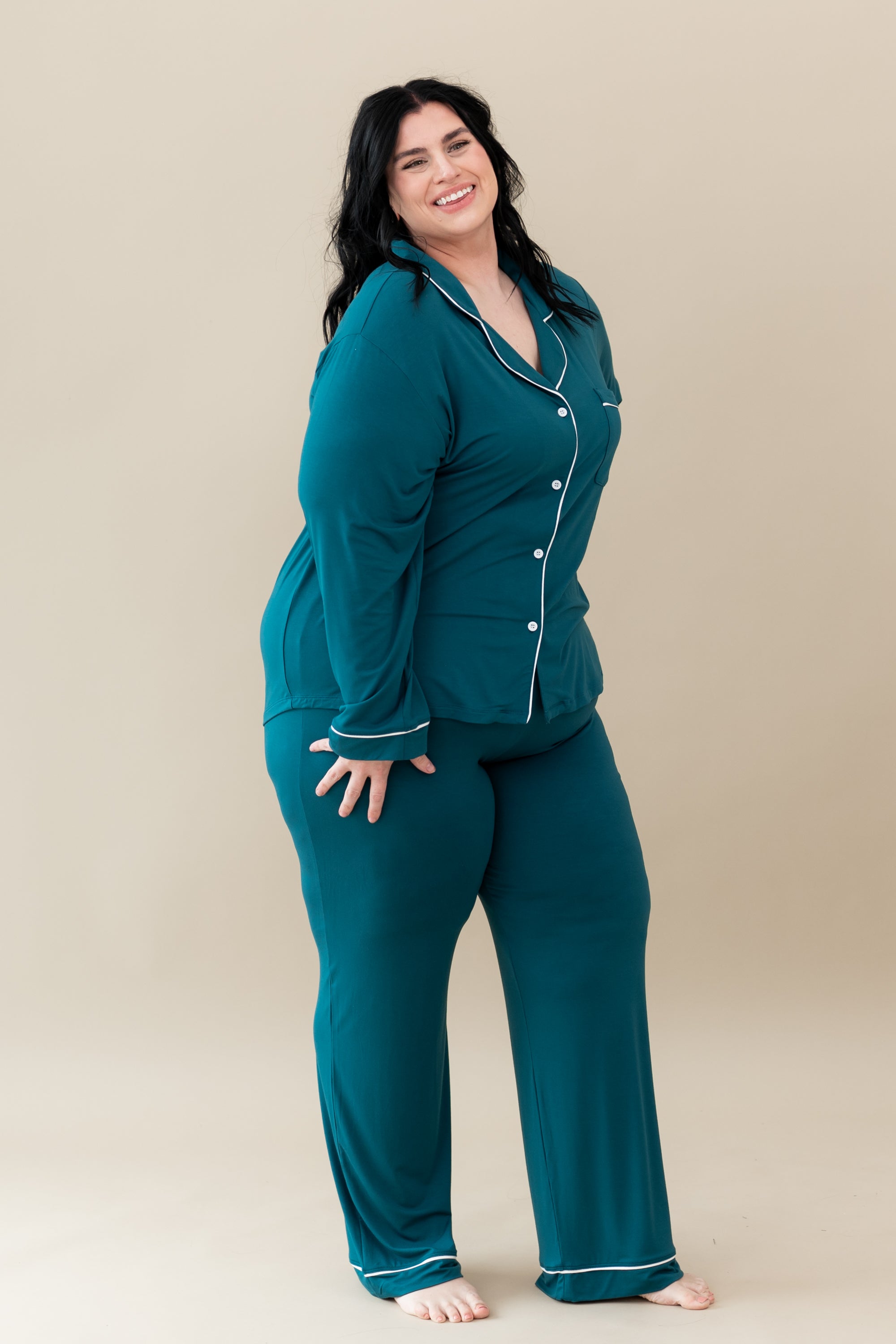 Smiling female wearing Women's Long Sleeve Pajama Set in Loch with Cloud Trim