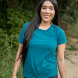 Female wearing the Women's Crew Neck Tee in Loch paired with black jeans