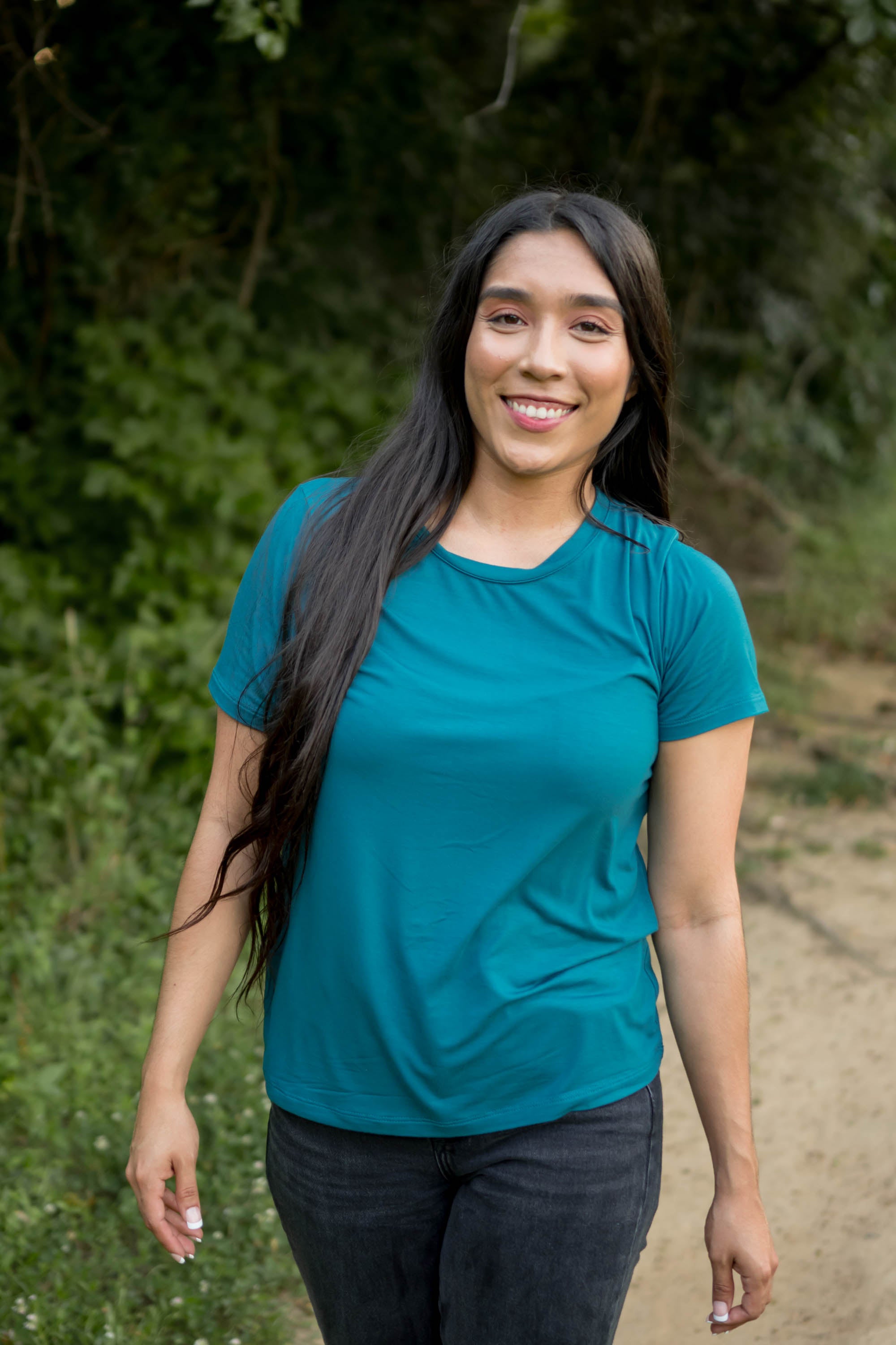 Female wearing the Women's Crew Neck Tee in Loch paired with black jeans
