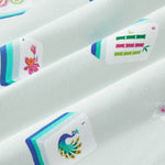 An all-over print featuring: white Mahjong tiles with a navy and turquoise back and various artworks; white jasmine flowers with pink centers and green leaves; white dice with pink, turquoise, and green markings; and turquoise teacups with navy trim, over a pale turquoise background color named Dew.